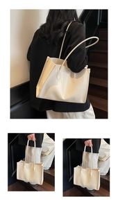 Detail showing high-quality smooth texture of white tote bag during daily commute use