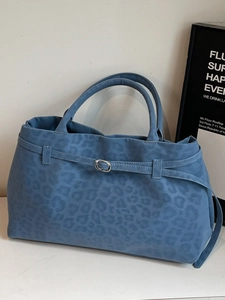 Blue faux suede tote bag with leopard emboss design and silver buckle detail
