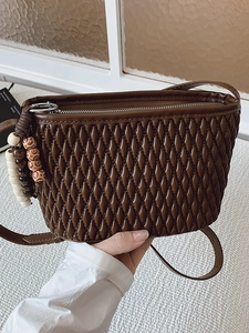 Brown pleated crossbody bag with wooden bead charm and high-quality quilted texture