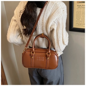 Brown gloss leather crossbody bag with embossed MIRA MIRA logo and gold hardware
