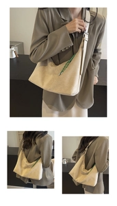 Detail of beige hobo tote bag featuring minimalist suede texture and green woven rope