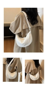 Detail view of white crescent dumpling crossbody bag with adjustable nylon shoulder strap
