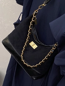 Suede and leather quilted crossbody bag with gold chain strap and twist lock detail