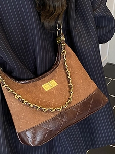 Brown quilted leather crossbody bag with gold chain strap and metallic twist lock clasp