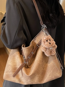 Vintage brown leather tote bag with eyelet strap and bear charm for women