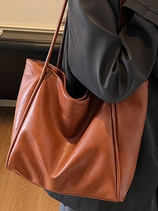 Brown vintage faux leather tote bag for women showing large capacity and shoulder straps