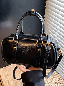 Classic black leather Boston handbag with gold hardware and adjustable strap for women