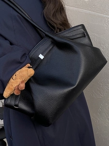 French vintage black lychee leather shoulder bag with a cute plush croissant pendant