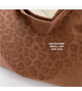 Close-up of soft leopard print tote bag fabric texture showing high-quality faux fur detail