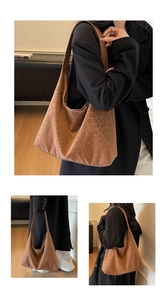 Close-up detail of leopard print hobo bag showing textured matte finish and slouchy shape