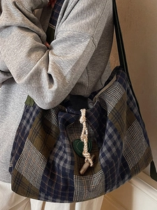 Retro plaid tote bag with green heart patch and toggle closure for autumn commute