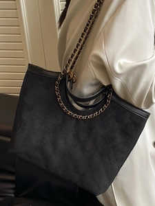 Quilted black suede tote bag with gold chain straps and large capacity for women