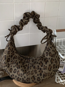 Chic leopard print underarm bag with scrunchie handle in vintage faux suede style