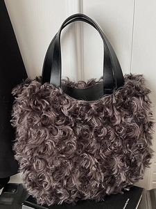 Minimalist dark gray plush bucket handbag with black leather handles for daily autumn style