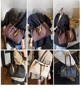 Multiple views of a large capacity tote bag with chic bead pendant and long handle