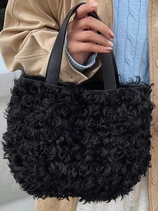 Fashionable black faux fur bucket bag with leather handles for minimalist autumn daily wear