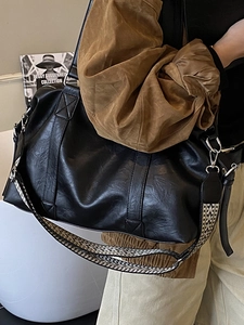 Large black vintage tote bag with geometric jacquard strap for daily travel use