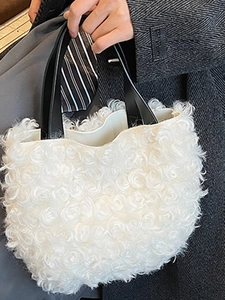 Stylish white plush bucket tote with black leather handles for 2025 autumn fashion