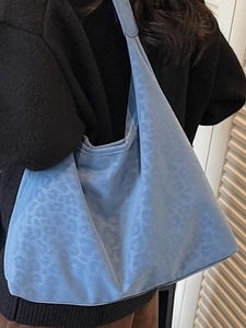 Fashionable light blue leopard print tote bag for women featuring large capacity shoulder style