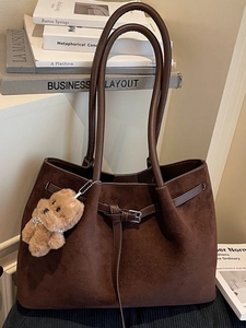 Retro dark brown suede tote bag with plush bear charm and buckle detail for women