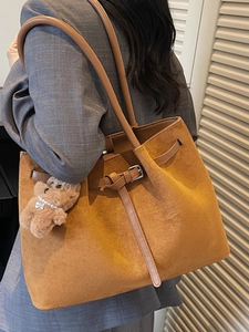 Vintage brown suede tote bag with shoulder straps and cute bear charm for daily commute