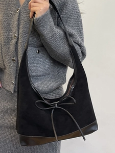 Retro black suede and patent leather hobo shoulder bag with elegant bow detail