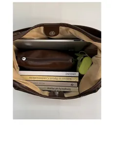Top view of spacious leopard print tote showing laptop, books and umbrella storage
