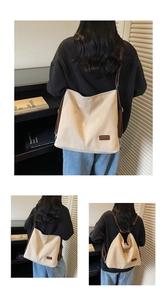 Detail showing the cream canvas tote with adjustable brown leather straps for multi-way carry