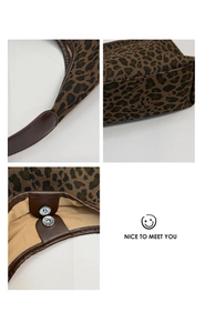 Detail of leopard print tote featuring magnetic closure and premium stitching details