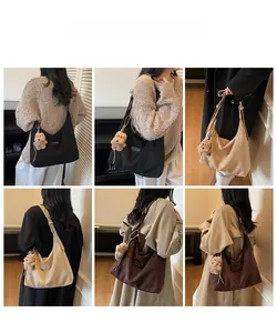 Detailed view of large hobo tote bags in three colors with plush bear charms