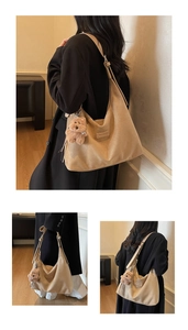 Detail of khaki large hobo bag with Bananu brand tag and cute plush bear charm
