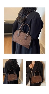 Detail of vintage leopard print leather handbag with adjustable strap and top handle