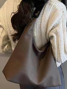 Retro coffee brown large tote bag in soft leather shown on model for daily commuting
