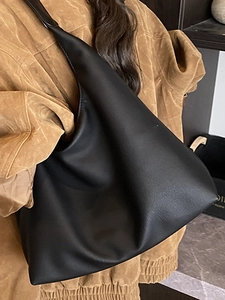 Minimalist black leather hobo shoulder bag for women with spacious commuter design