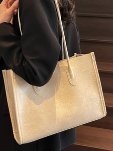Retro beige tote bag with crinkled texture and slim straps for daily autumn commute
