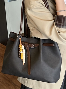 Vintage large dark grey tote bag with brown straps and colorful bead pendant accessory