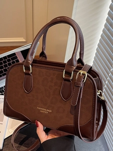 Chic dark brown leopard print拼接 pillow handbag with golden hardware and shoulder strap
