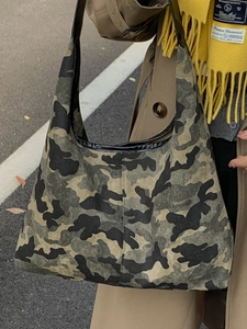 Large camouflage canvas tote bag for women with black shoulder straps and spacious design