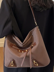 Vintage brown hobo tote bag with metal studs and tassels for women's daily commute