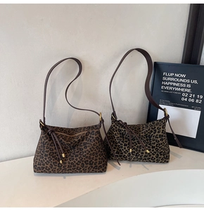 Detailed view of leopard print hobo bags with high-quality fabric and leather straps