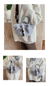 Detail of light grey faux fur bucket bag with wooden beads and adjustable leather strap