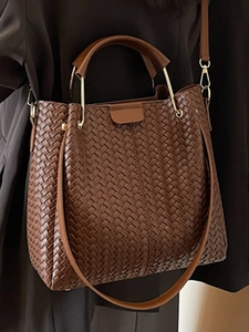 Chic dark brown woven leather bucket bag with top handle and crossbody strap for women