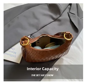 Detailed view of brown woven bag internal capacity for phone and essentials