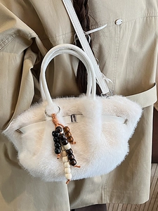Chic white faux fur bucket bag with wooden bead tassel and crossbody strap for women