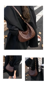 Detail of dark brown woven leather hobo bag with a stylish half-moon structure and strap