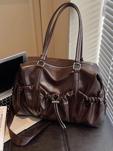 Vintage dark brown wrinkled leather tote bag with drawstring detail and wide shoulder strap