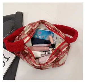 Detail of red and beige plush checkered tote bag showing spacious internal storage