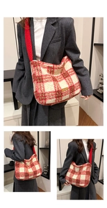 Detail of red and white checkered plush shoulder bag featuring a metallic logo plate
