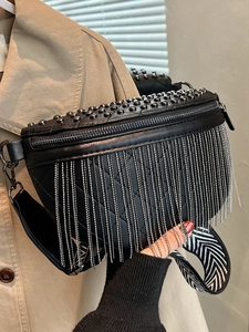 Quilted black waist bag with rivets and silver chain fringe on a wide strap