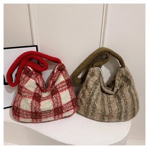 Detail of wool fabric texture and patterns on large autumn shoulder tote bags